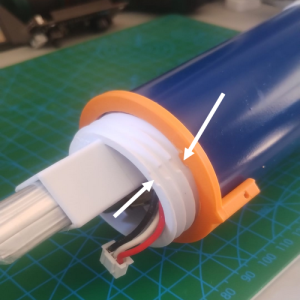Fig. 4.5.35: Lamage du compartiment électronique et ergot du guide de perçage